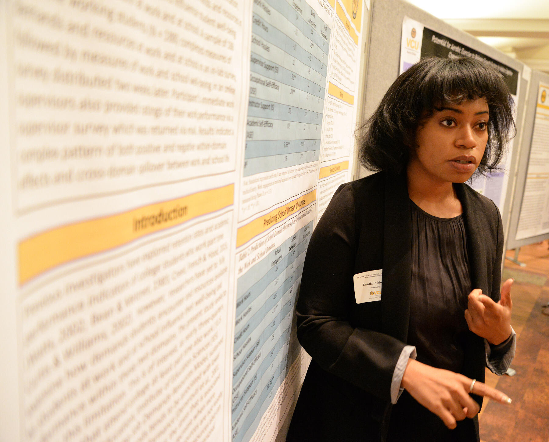 Candace Moore discusses her research on the impact of student employment during the 10th Annual Poster Symposium for Undergraduate Research and Creativity, held Wednesday, April 20 at the University Student Commons.