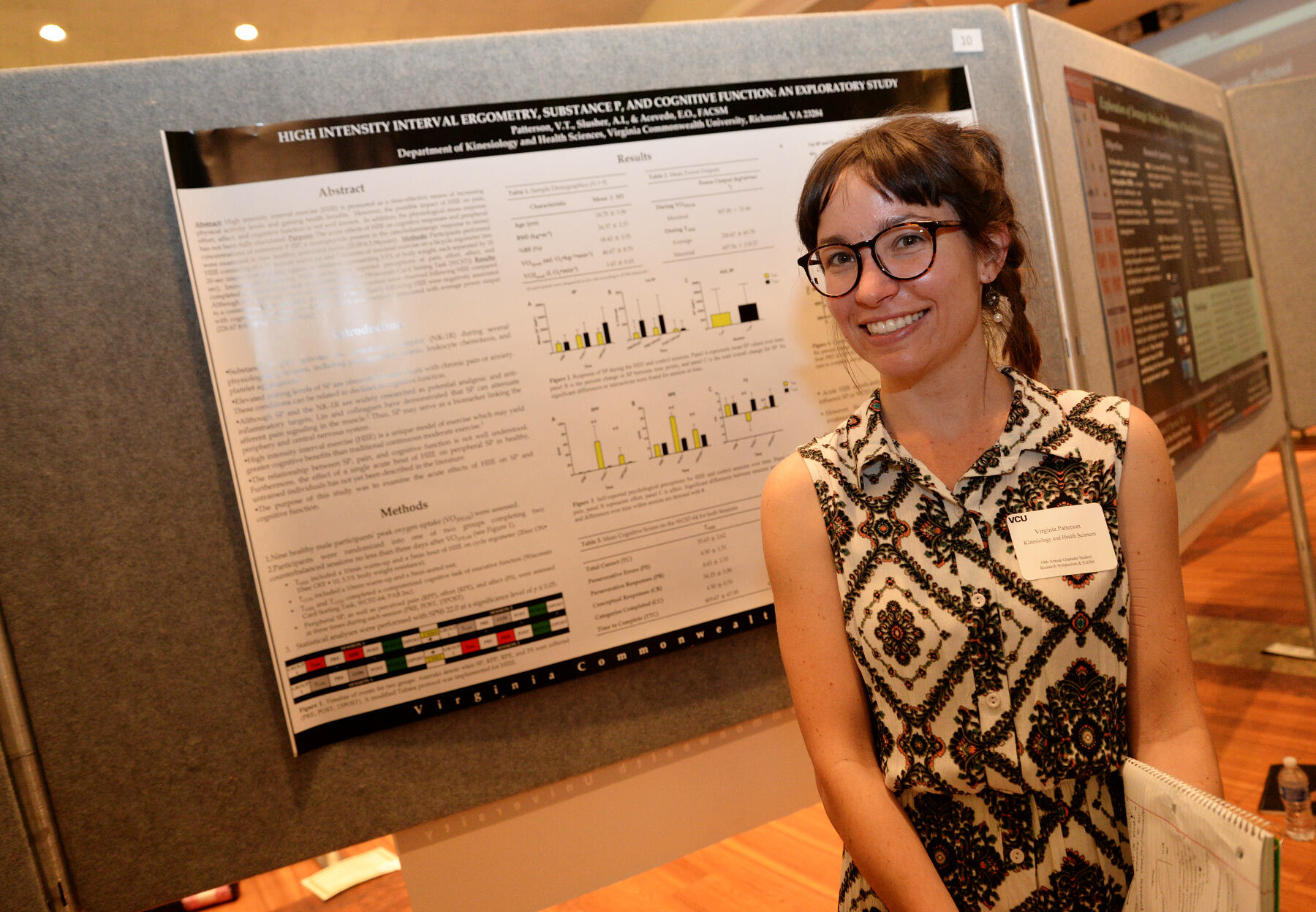 Virginia Patterson, a Kinesiology and Health Sciences student, presents her poster Tuesday, April 19 during the 19th Annual Graduate Research Symposium and Exhibit at the University Student Commons.