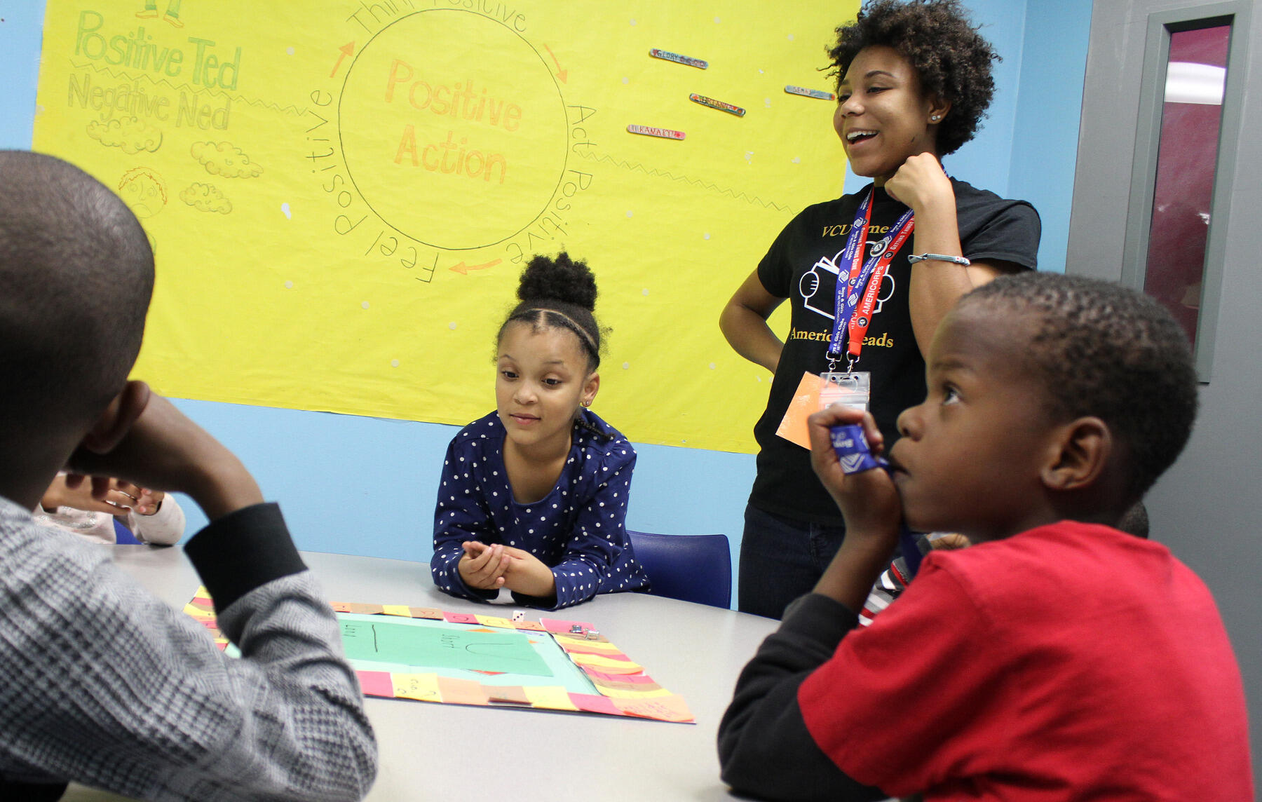 VCU AmeriCorps member Jasmine Johnson leads a literacy game with kids at the Southside Boys and Girls Club.<br>Photo by Pat Kane, VCU Public Affairs