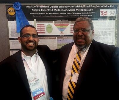 Abdulkhaliq Jassem Alsalman with his faculty adviser, Wally Smith, and his prize-winner poster presentation