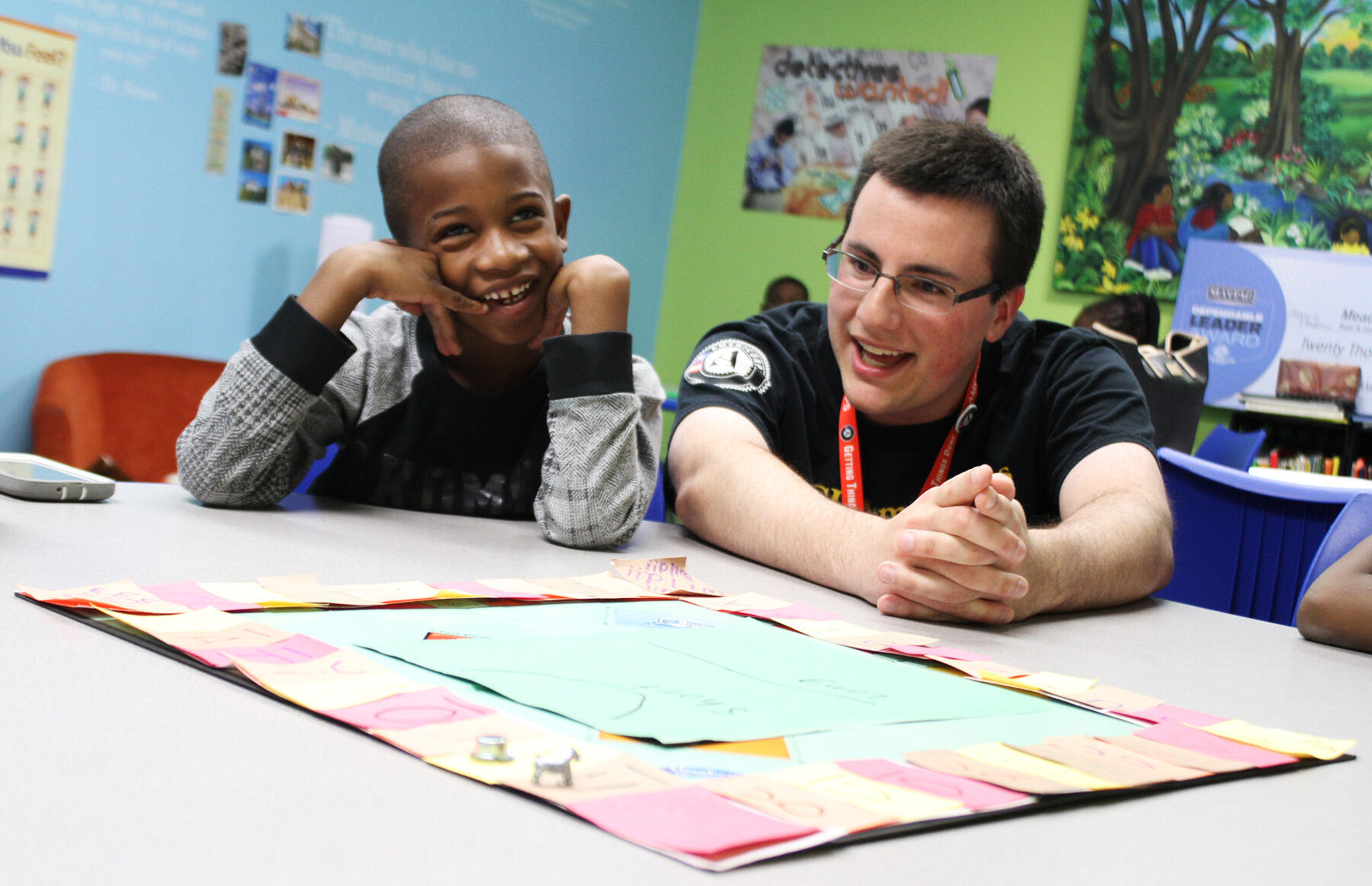 VCU AmeriCorps member Spencer Nichols and Christian Bailey try to think up words while playing a game with other Southside Boys and Girls Club members.<br>Photo by Pat Kane, VCU Public Affairs