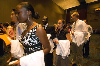 First year VCU School of Medicine students line up and prepare to be robed during this year's White Coat Ceremony.

Photo by Allen Jones, VCU Creative Services
