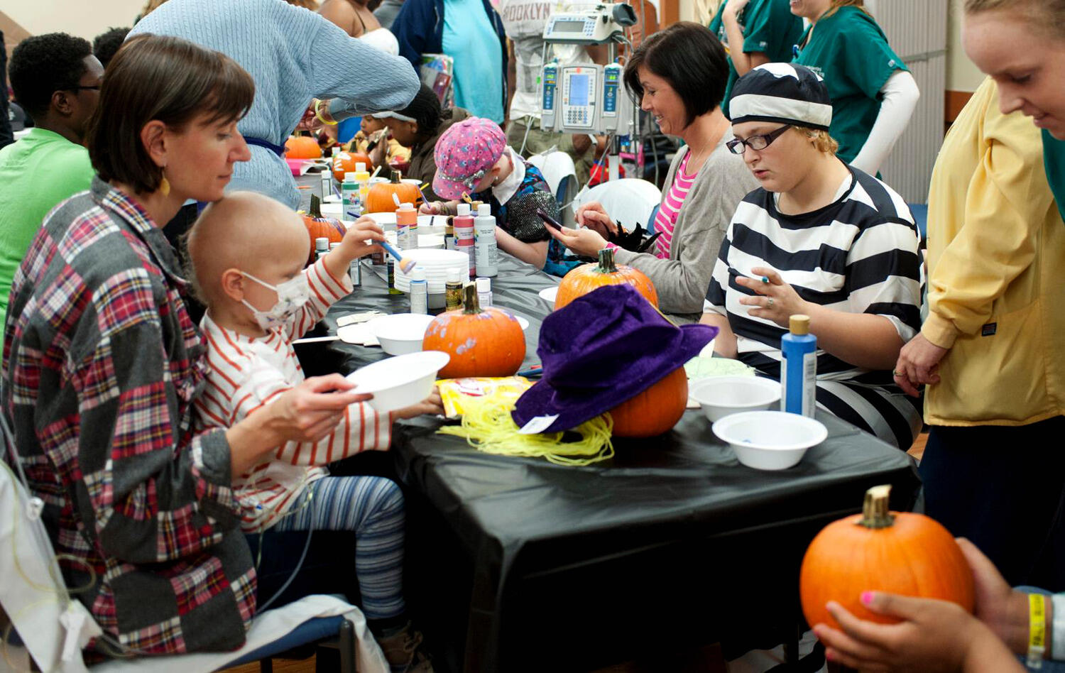 Patients and families enjoy crafts during a previous year's early Halloween party at CHoR.
