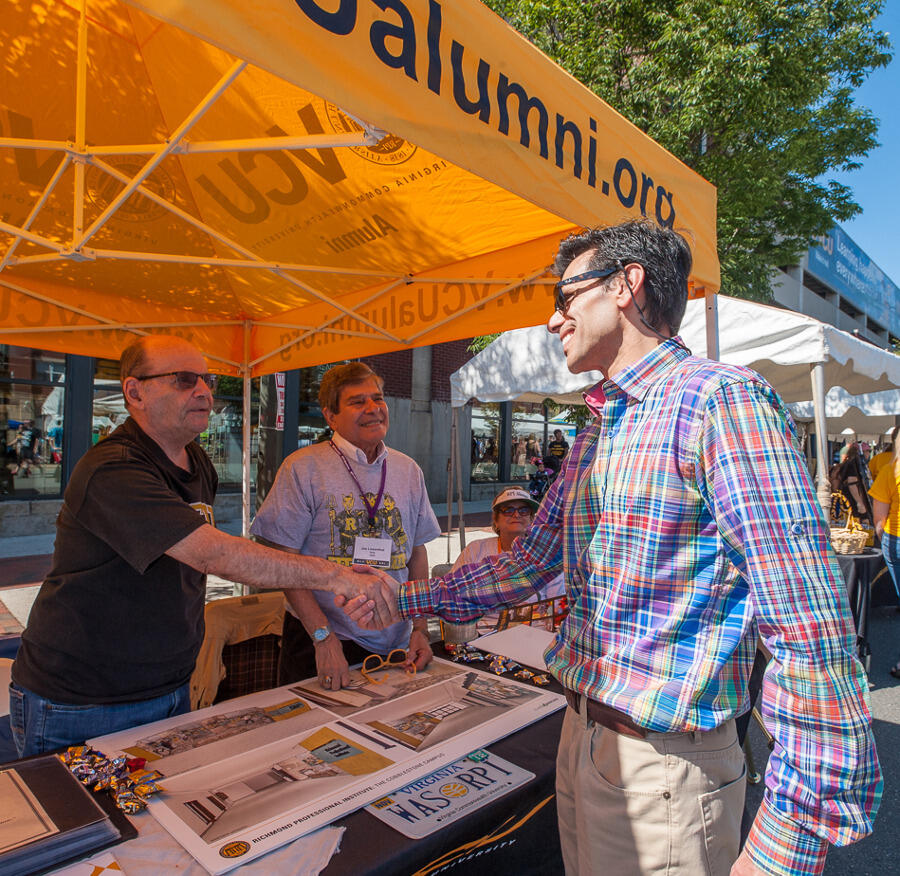 VCU President Michael Rao, Ph.D., visits one of the many booths at last year's event.