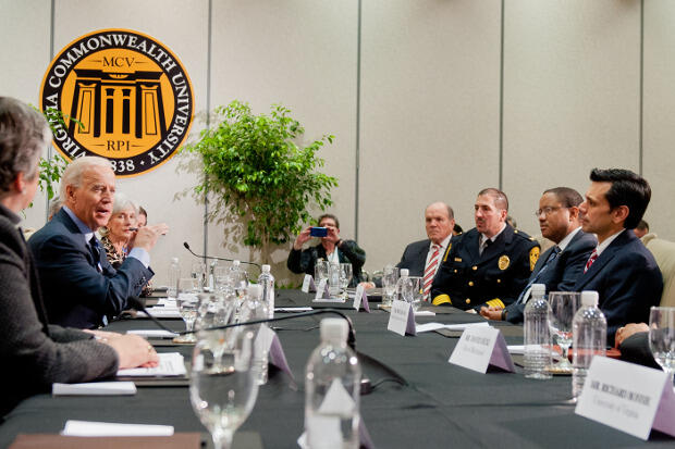 Vice President Joe Biden, left, at his visit to VCU in 2013. Biden's office invited VCU Police Chief John Venuti (at right, in uniform) to the White House last week for a summit on sexual assault. (File photo)