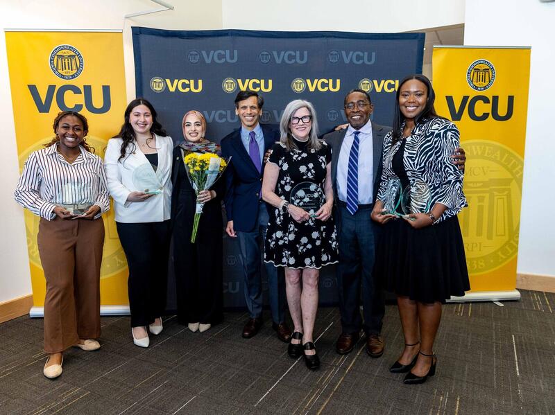 A group photo of seven people. 