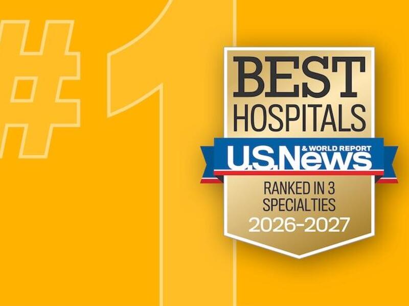 A yellow background with a \"#1\" in a ligher yellow. On top is a seal that says \"BEST HOSPITALS\" \"U.S. News & WORLD REPORT\" \"RANKED IN 3 SPECALITIES\" \"2026-2027\"