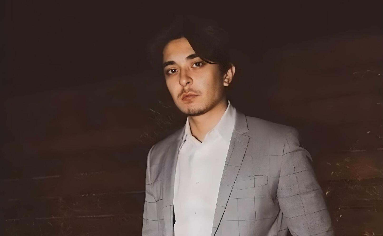 A portait of a man from the waist up 