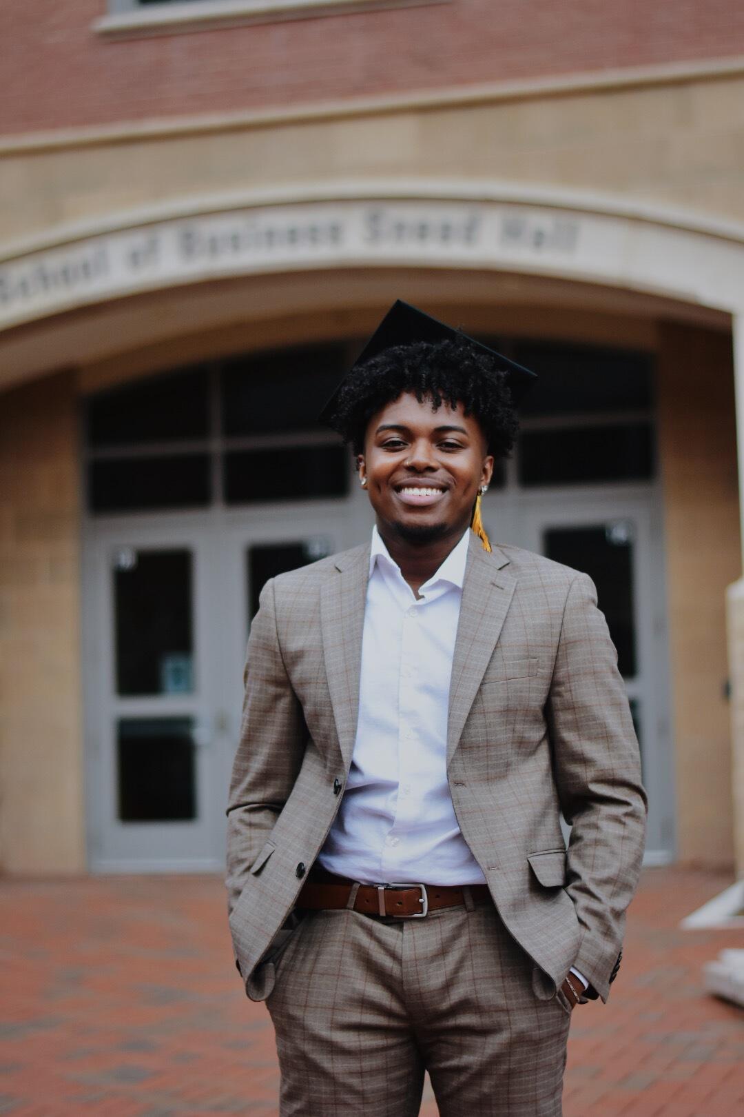 A man standing with his hands in his pockets 