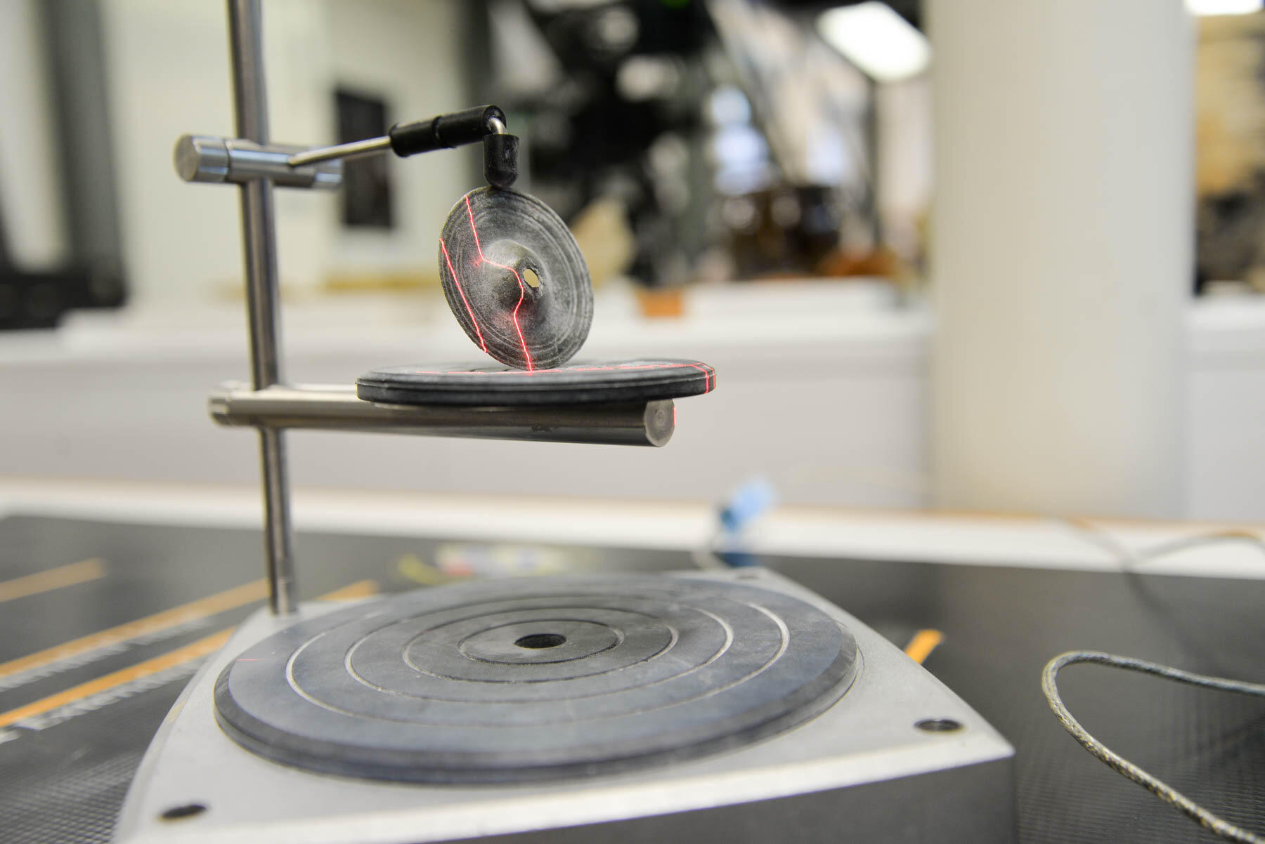 Means used a NextEngine desktop 3-D scanner to create a 3-D digital model of the tambourine jingle found at Jamestown.