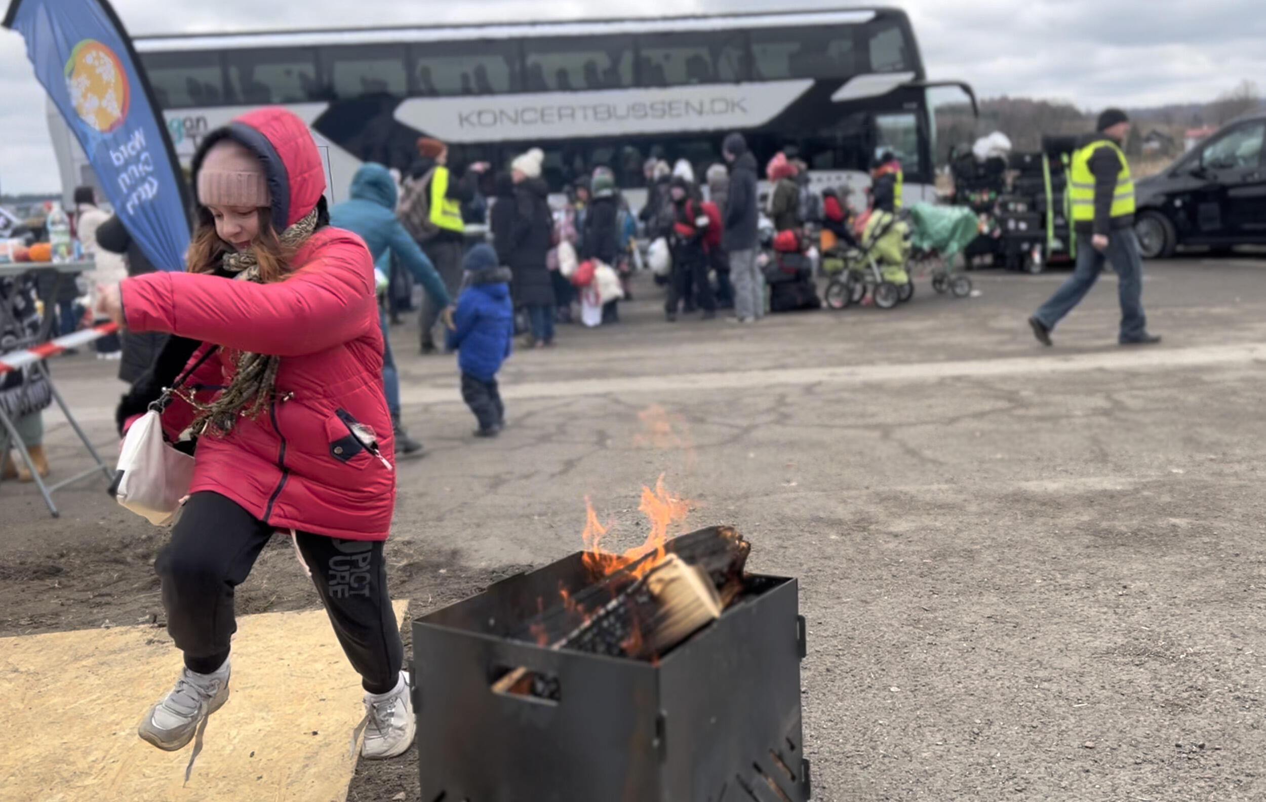 A child playing near a fire