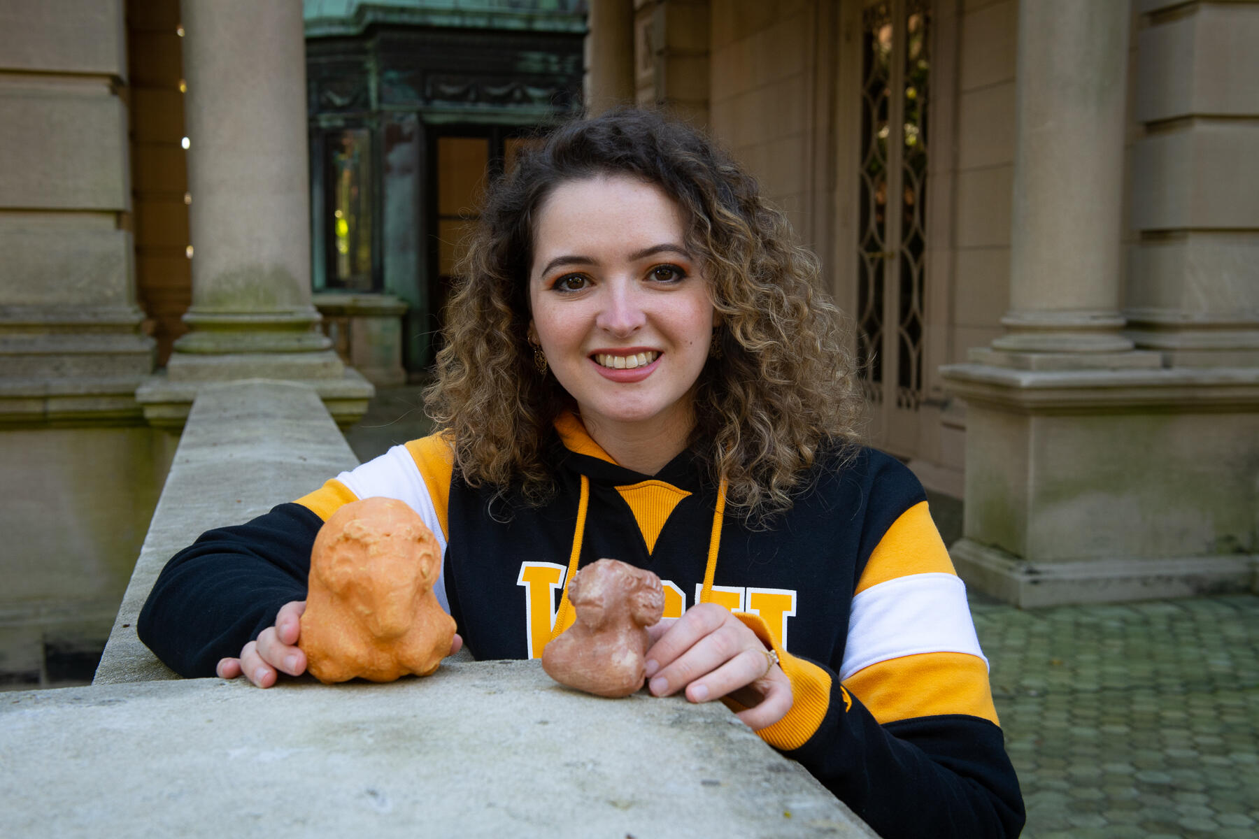 Anthropology major Amelia Sunnen holds some of the 3-D replicas of artifacts from Uttarakhand, a remote trans-Himalayan region in northern India. 