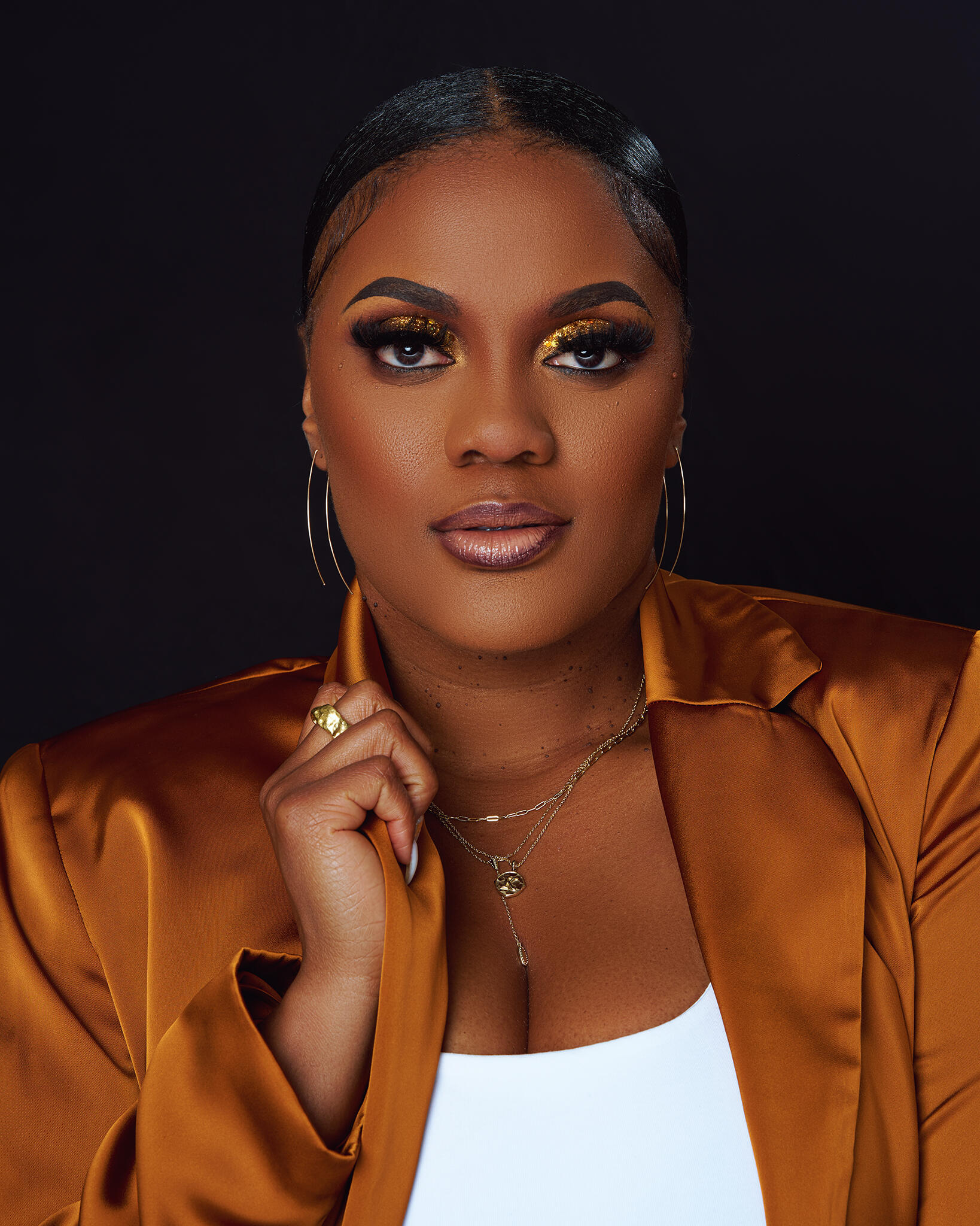 A photo of a woman from the shoulders up. 