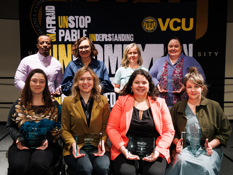 A group photo of eight people.