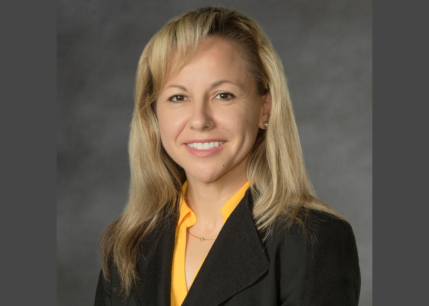 Woman in business attire.