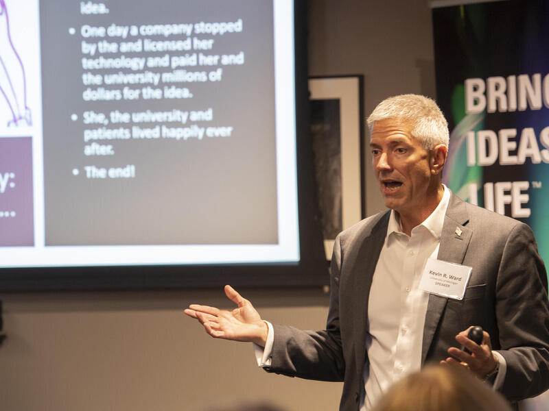 Kevin Ward speaking to an audience.