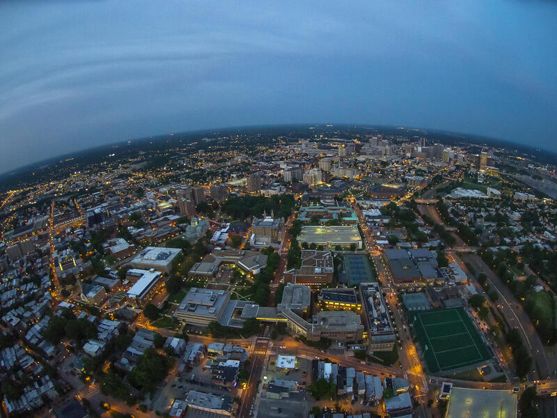 An Arial view of the city of Richmond at dusk, with a dark sky and the city street lights on 