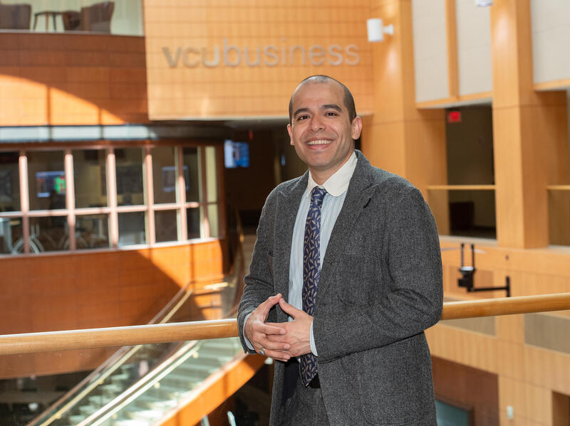 A photo of a man from the waist up. 