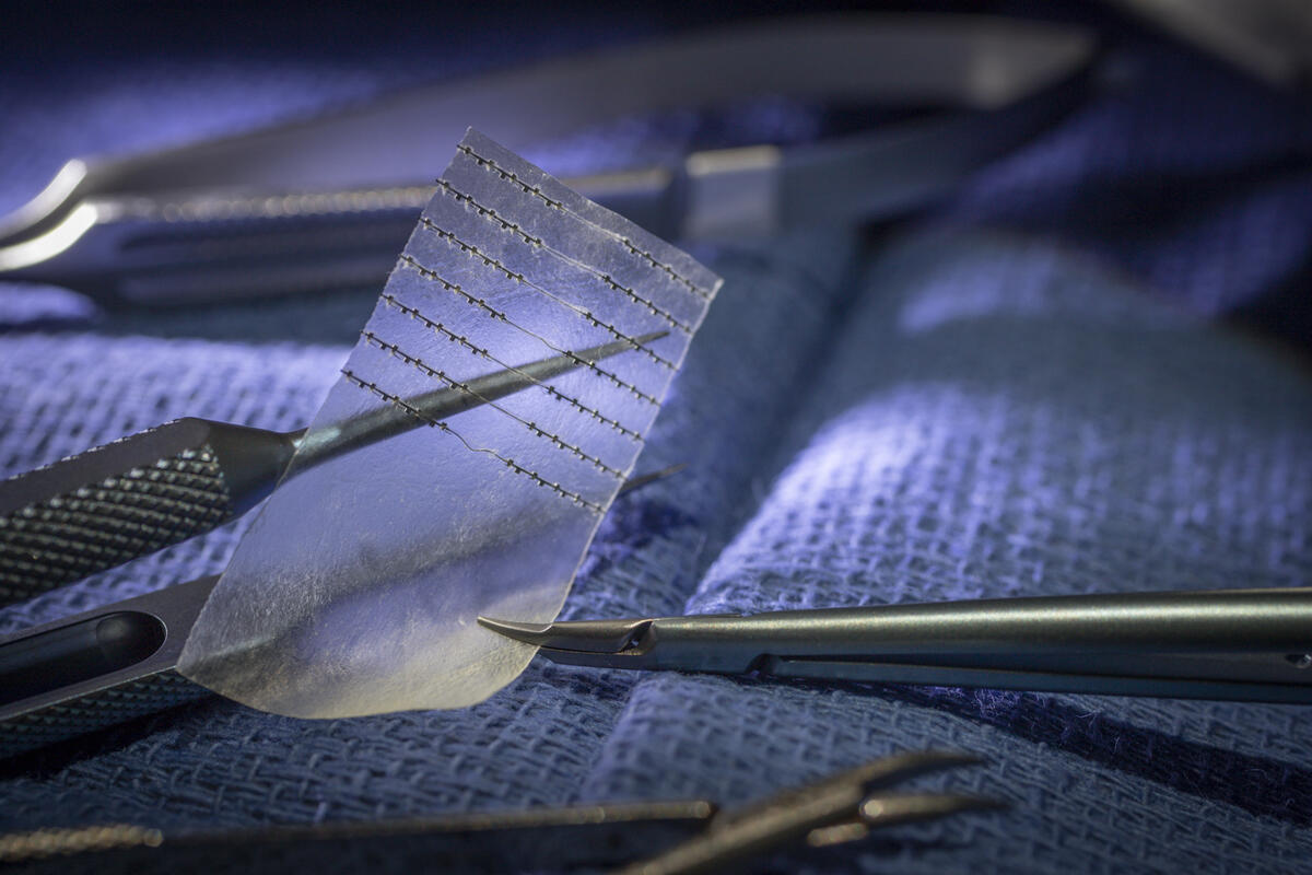 A piece of nerve tape stuck on the end of a metal medical instrument 