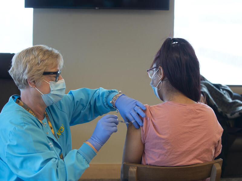 A VCU student receives a COVID-19 vaccine