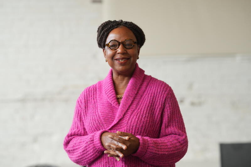 A photo of a woman from the waist up. 