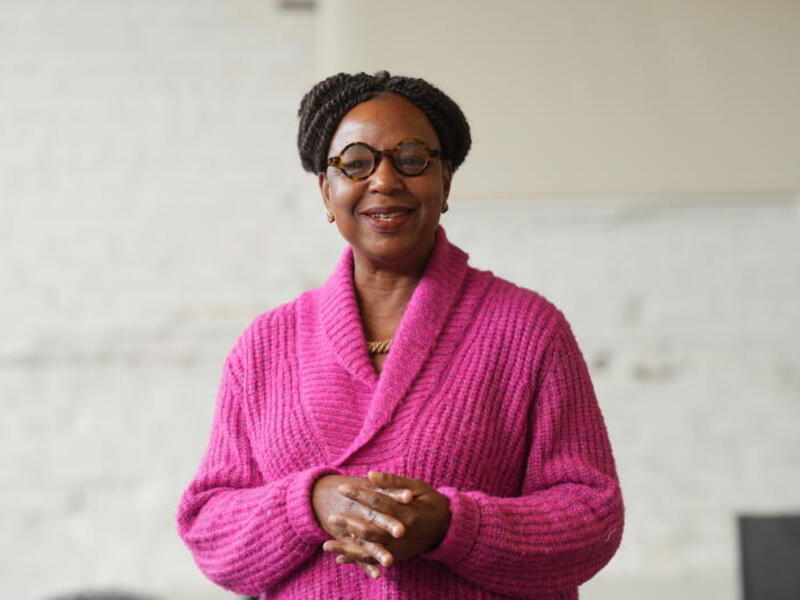 A photo of a woman from the waist up. 