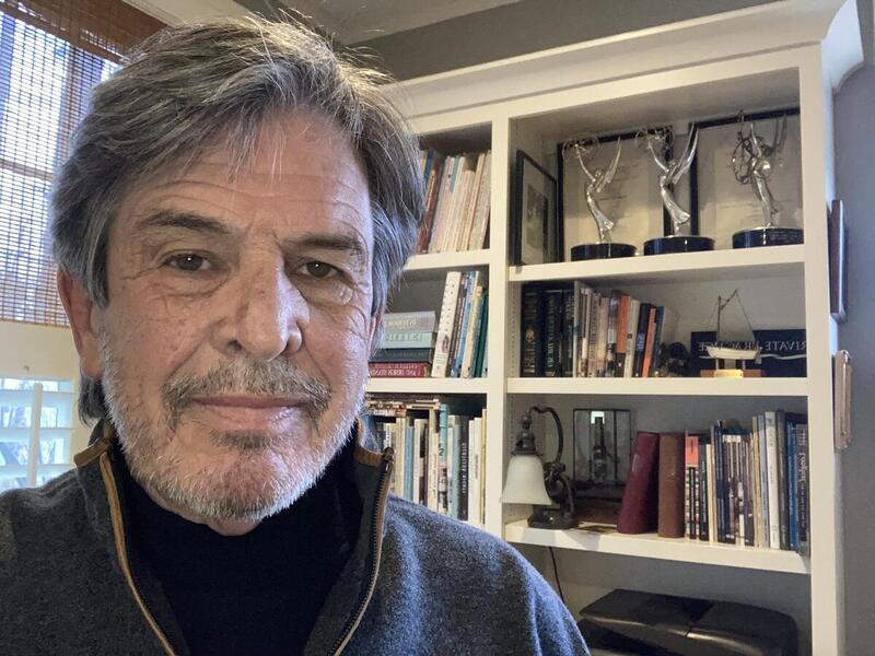 A photo of a man from the shoulders up 