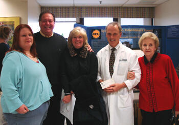 From left: Becky Britt, sister of Gerry Bertier; Buck Sutton, executive director of the Gerry Bertier #42 Foundation and Bertier’s cousin; Cheryl Sutton, Bertier’s cousin; William McKinley, M.D., professor in the Department of Physical Medicine and Rehabilitation; and Jean Agnew, Bertier’s mother. Photo by Malorie Janis