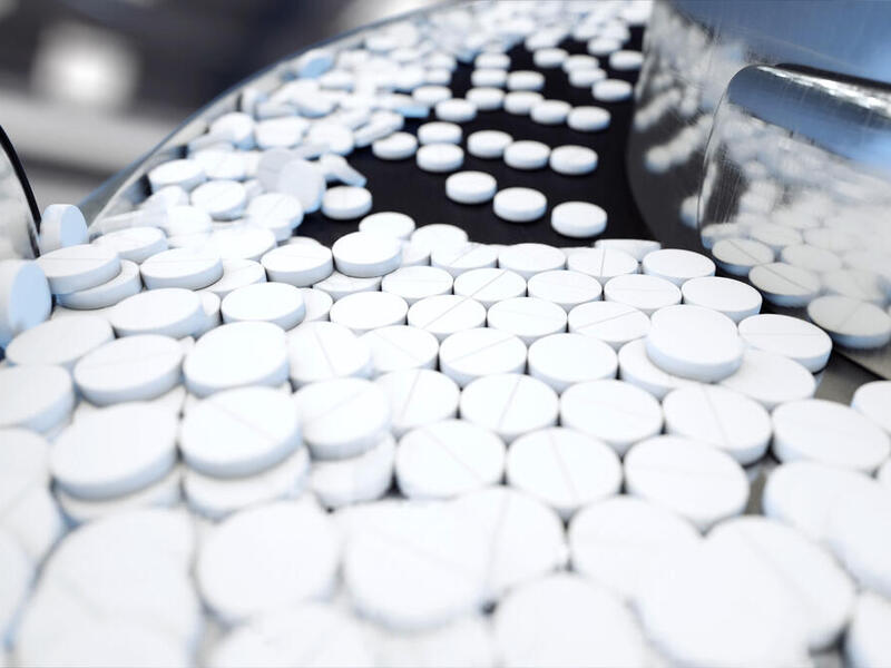 Pharmaceutical products in a manufacturing plant line.