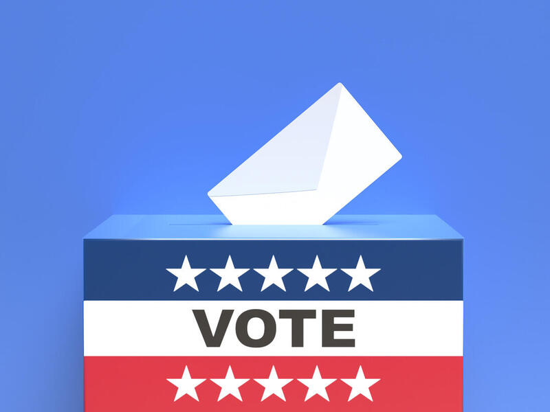 Three people standing outside Grace E. Harris Hall.