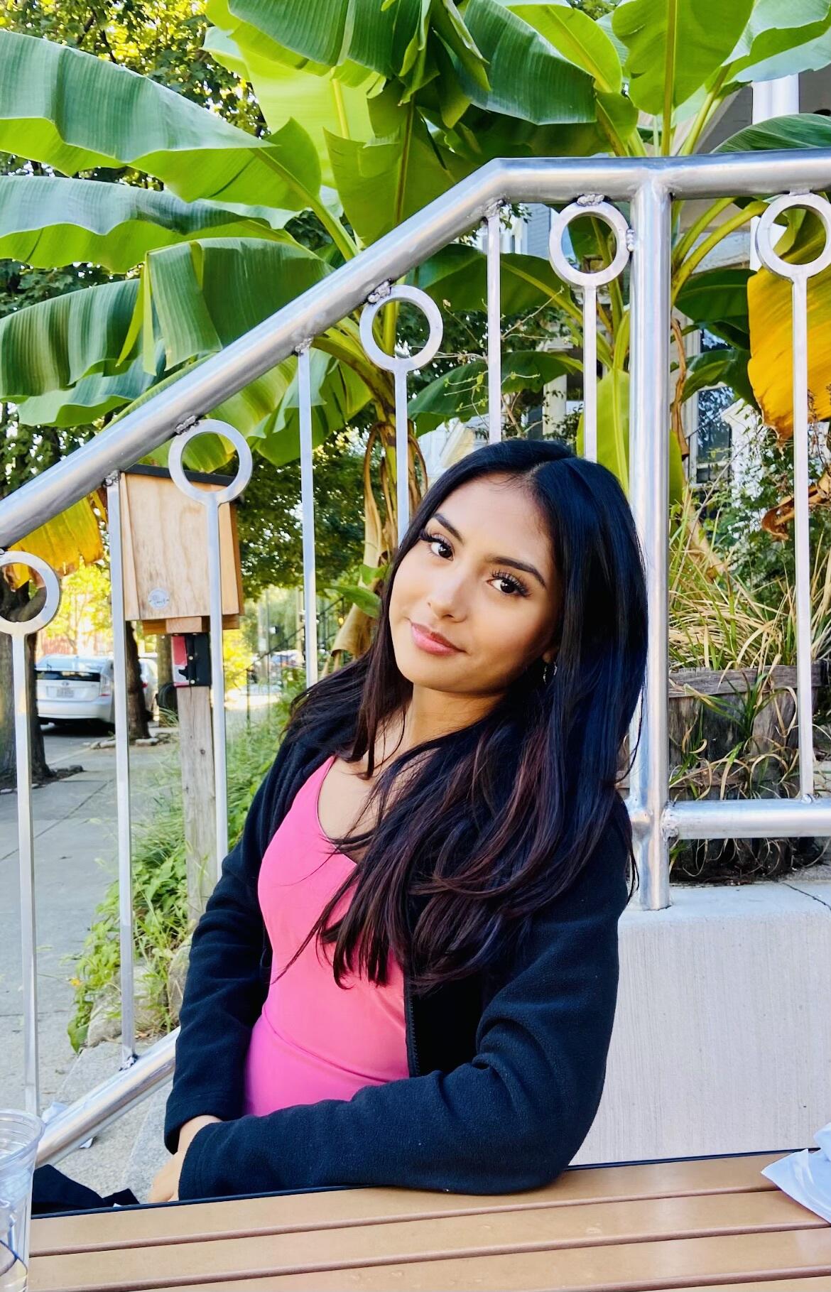 A portrait of a woman from the waist up 