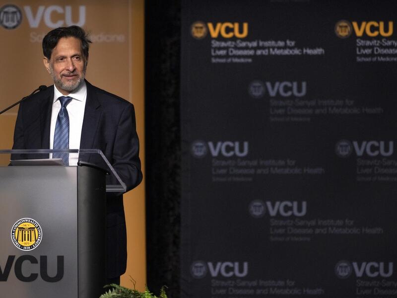 A man speaking at a podium