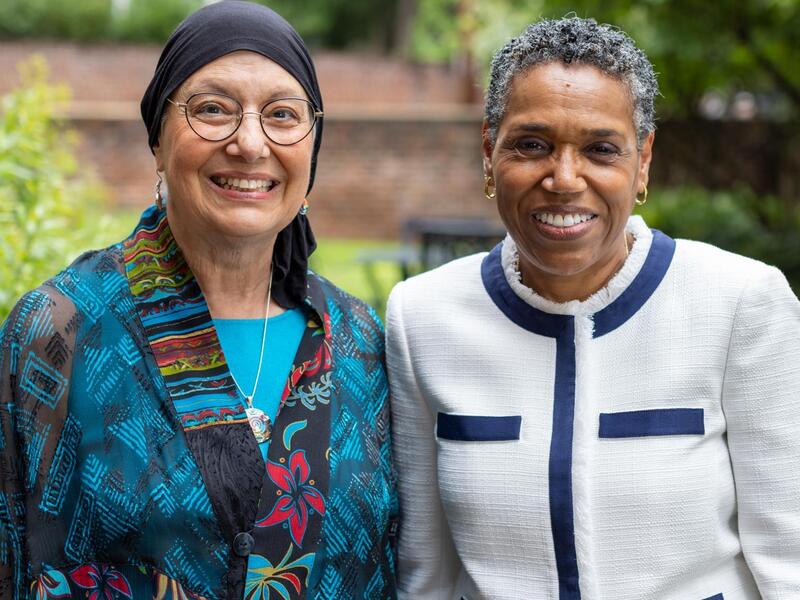Two women standing next to each other 