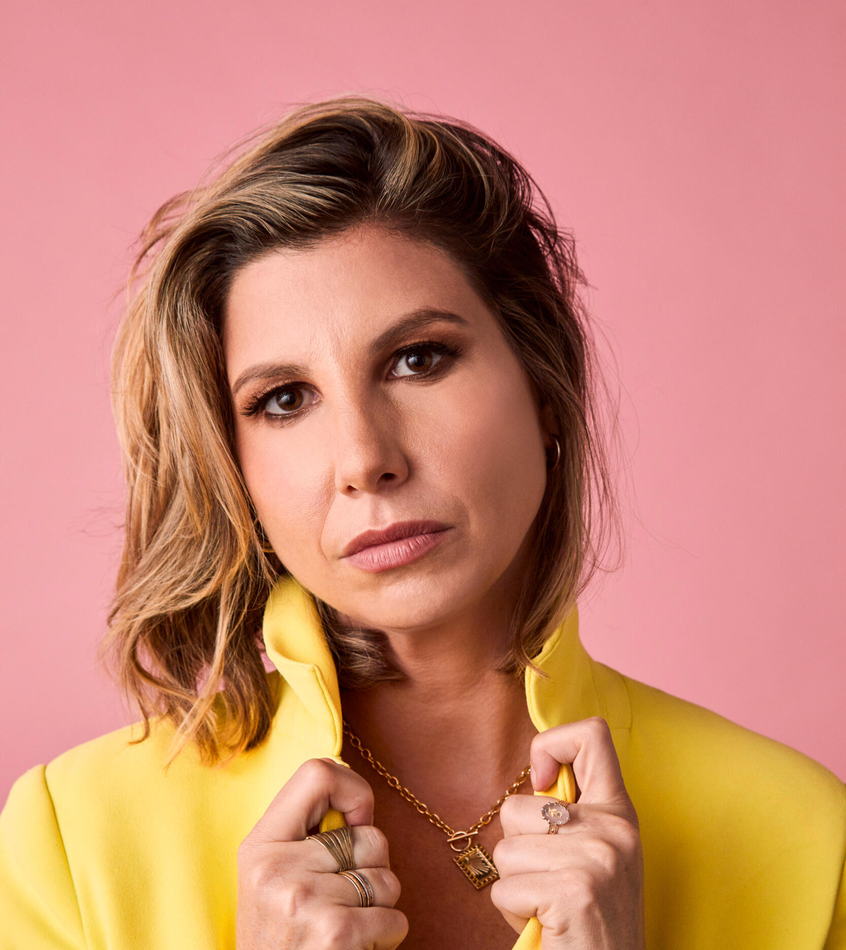 Head and shoulders image of Jessica Hendry Nelson, holding her collar.
