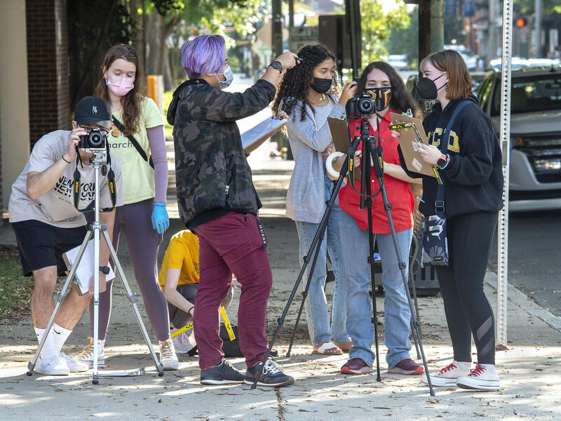 VCU students in a forensic science class stand on a street corner