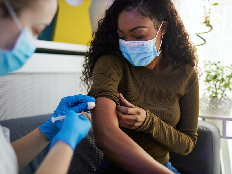 black woman getting vaccinated