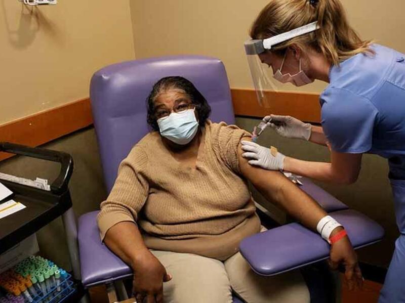 A VCU Health patient receives her first dose of the COVID-19 vaccine