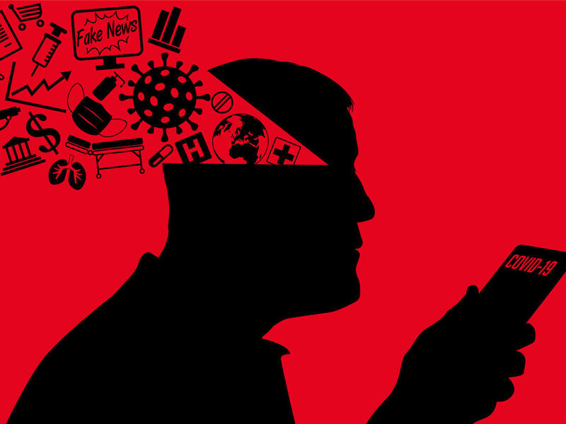 Drawing of a person holding a phone with \"COVID-19\" displayed. Various symbols are displayed entering their head.