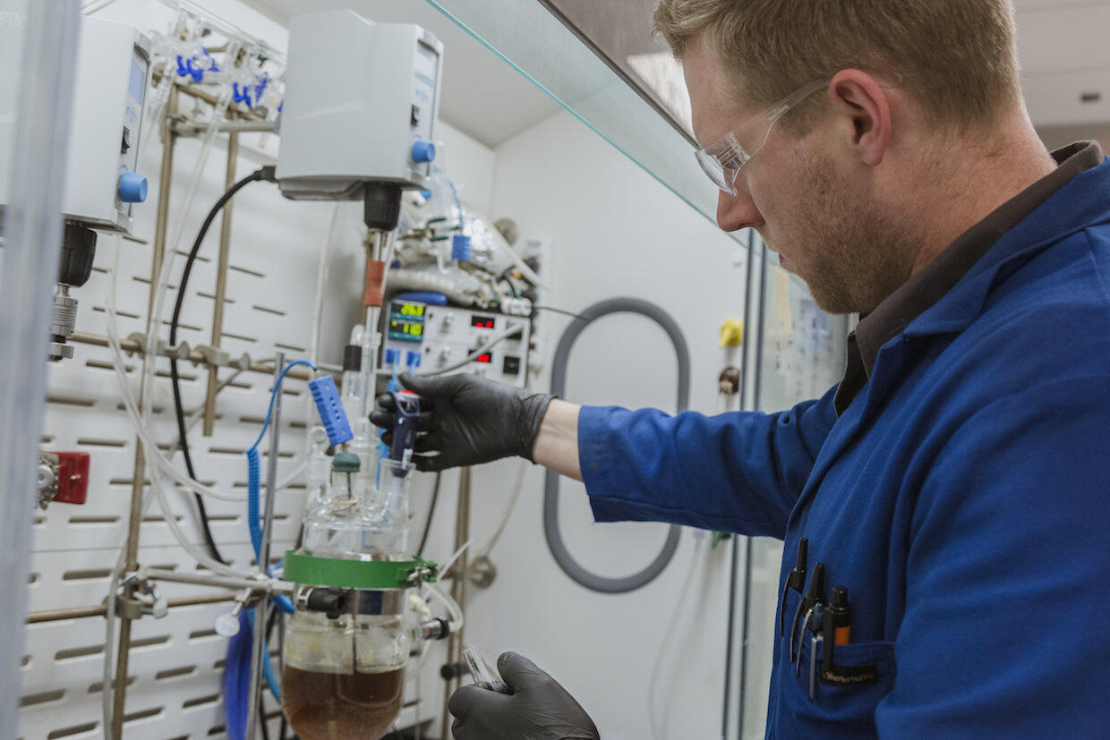 An employee runs tests in the Medicines for All lab at the VCU College of Engineering. 