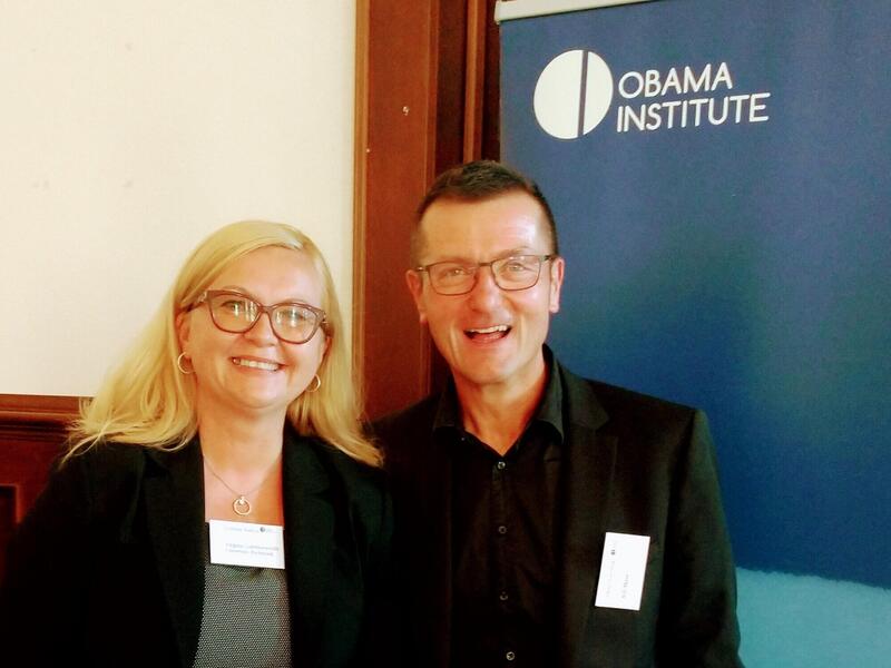 A woman standing to the left of a man 