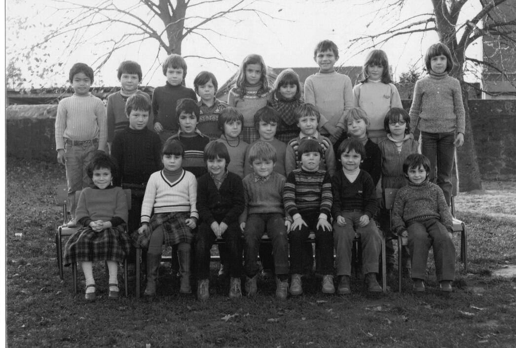 An old black and white photo of students in France. Nathan Tuoch is in the far left of the back row.