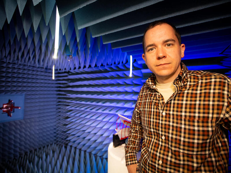 A photo of a man from the waist up. 