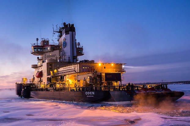 Ship breaking ice in arctic waters.
