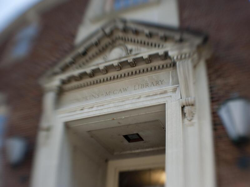 A doorway with a sign noting the Tompkins-McCaw Library on the M C V campus of V C U.