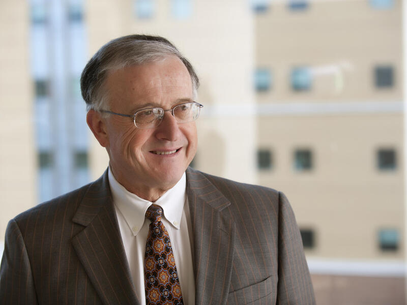 A photo of a man from the shoulders up. 