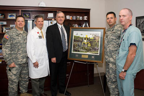 From left: Army Master Sgt. Danny Yakel, program administrator for the Richmond, SOCM program and senior instructor at JSOMTC; Kevin Ward, M.D., associate professor in the Department of Emergency Medicine and VCURES associate director; John Duval, CEO of MCV Hospitals; Army Command Sgt. Maj. Ledford, Stigall of JSOMTC; and Garrett Lewis, a preceptor for the training program.

Photo by Melissa Gordon, VCU Communications and Public Relations