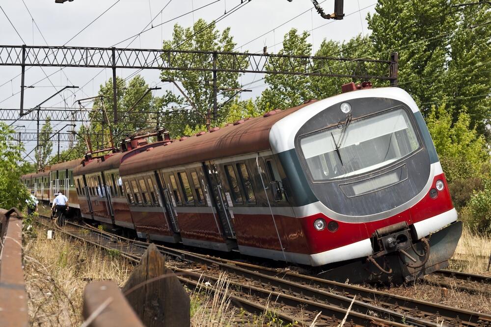 When trains derail, as pictured here, specialty cranes are deployed to place them back on the tracks. The risk of a tip-over is high. A VCU team is creating a display that reliably monitors a crane’s center-of-gravity in harsh, unpredictable conditions and lets operators know when it is in danger of tipping. (Getty Images)
