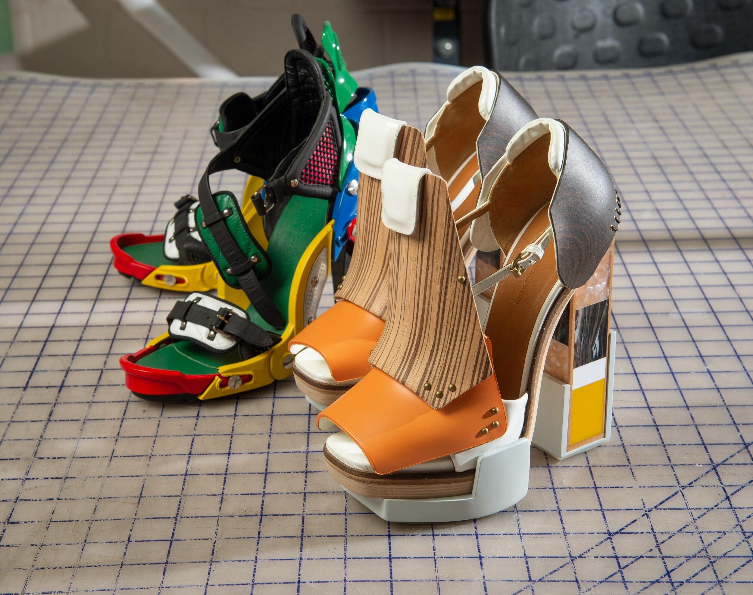 A photo of two paris of high heels. 