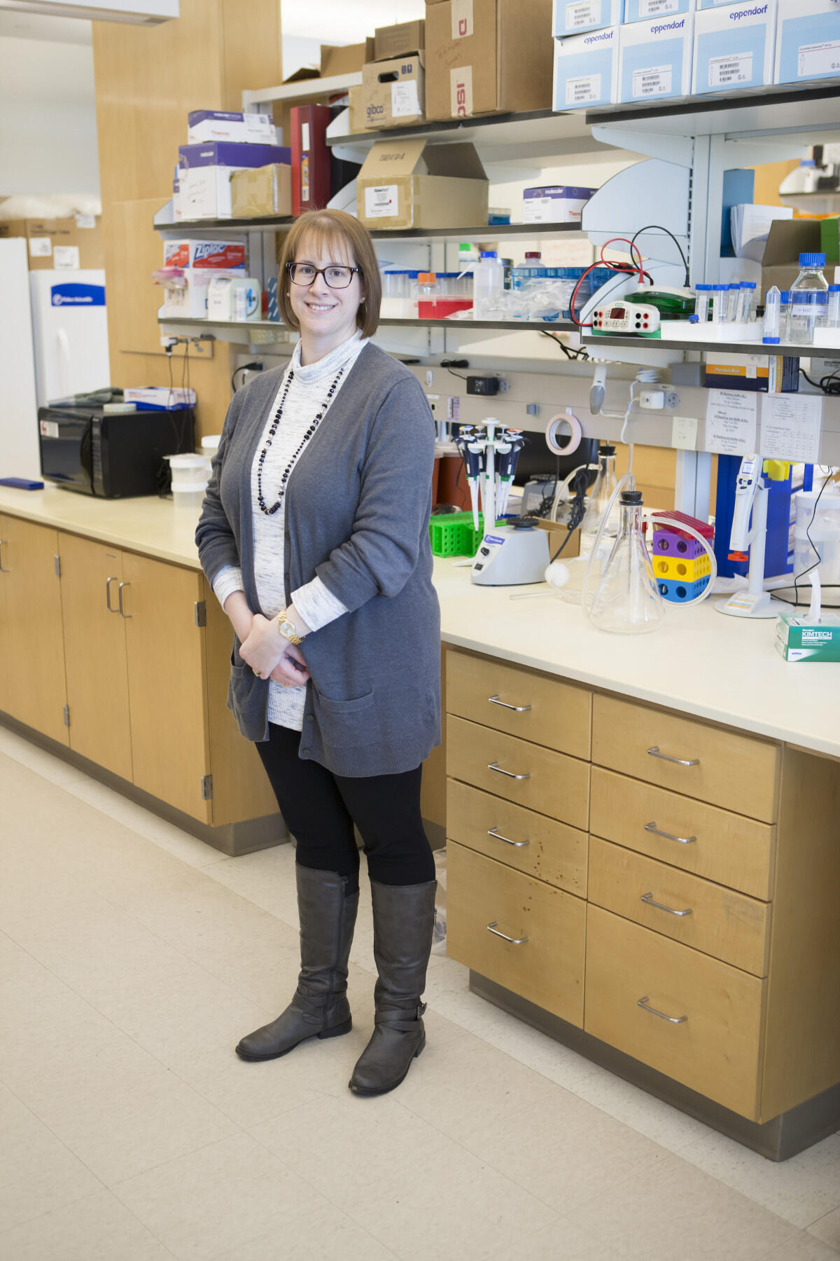 Woman standing in laboratory.