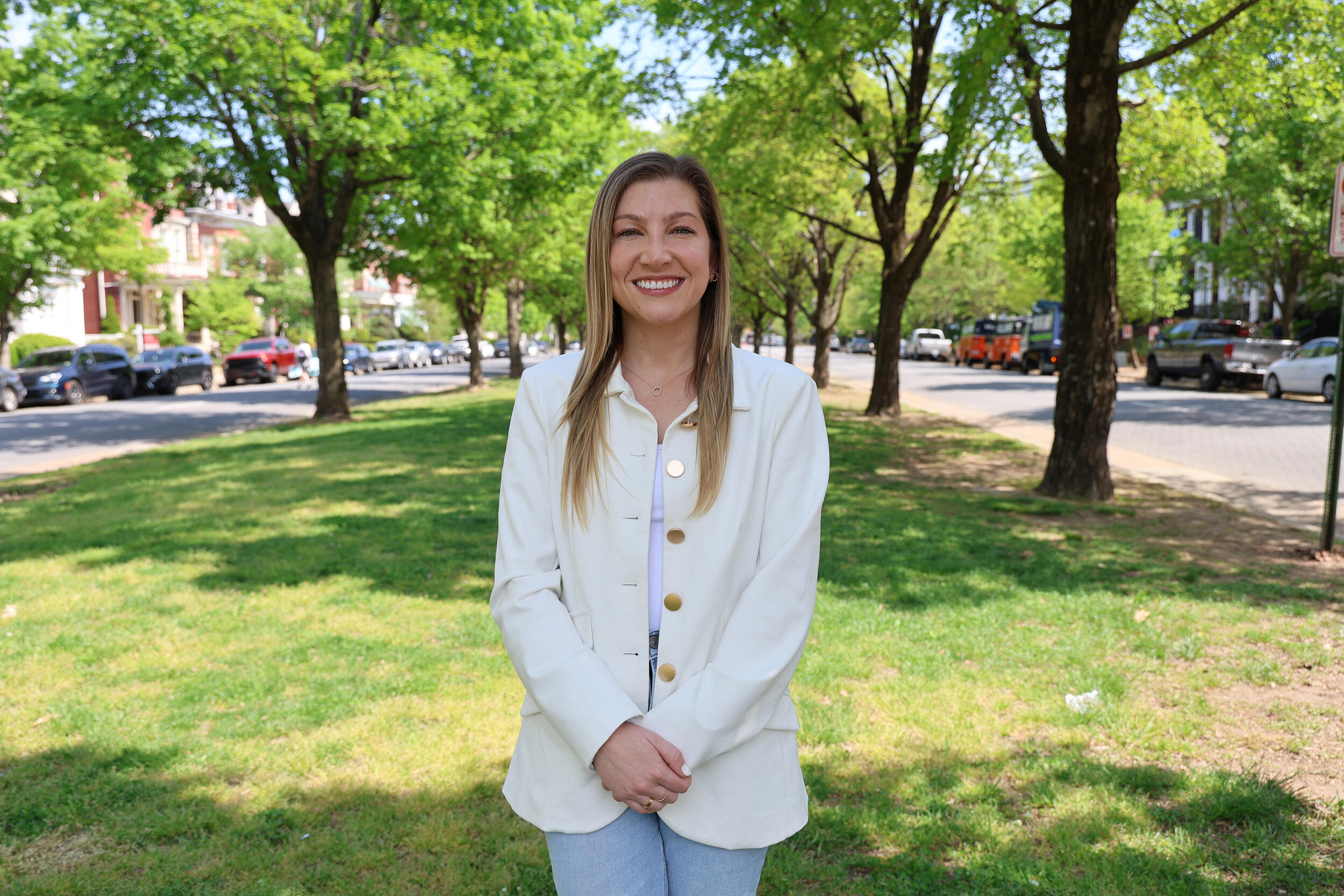 A photo of a woman standing from the knees up. 